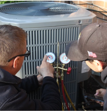 Home Comfort USA employee speaking with a homeowner at their doorstep