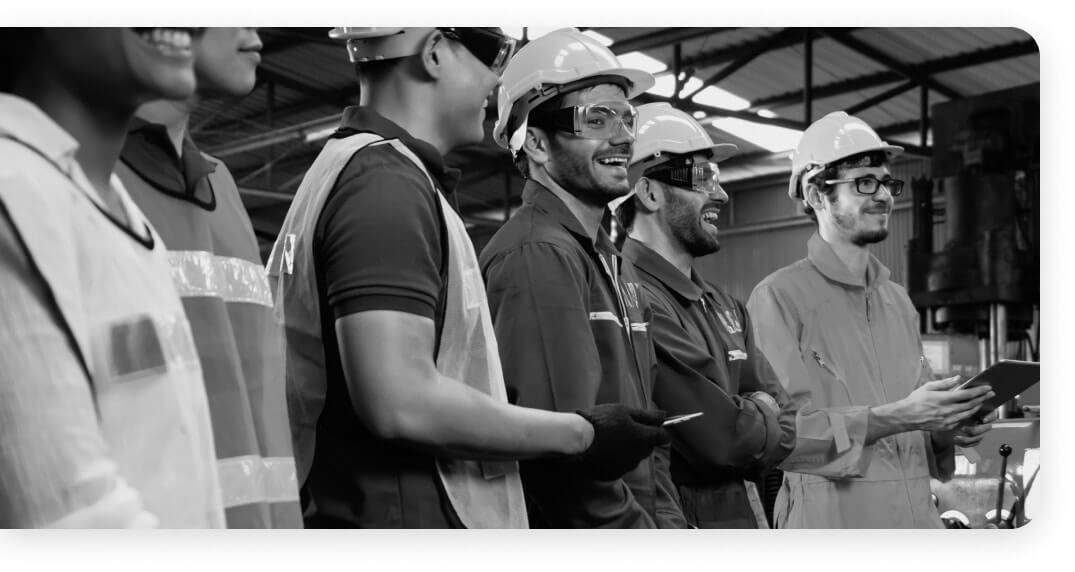 Smiling Home Comfort USA technician standing confidently with arms crossed 
