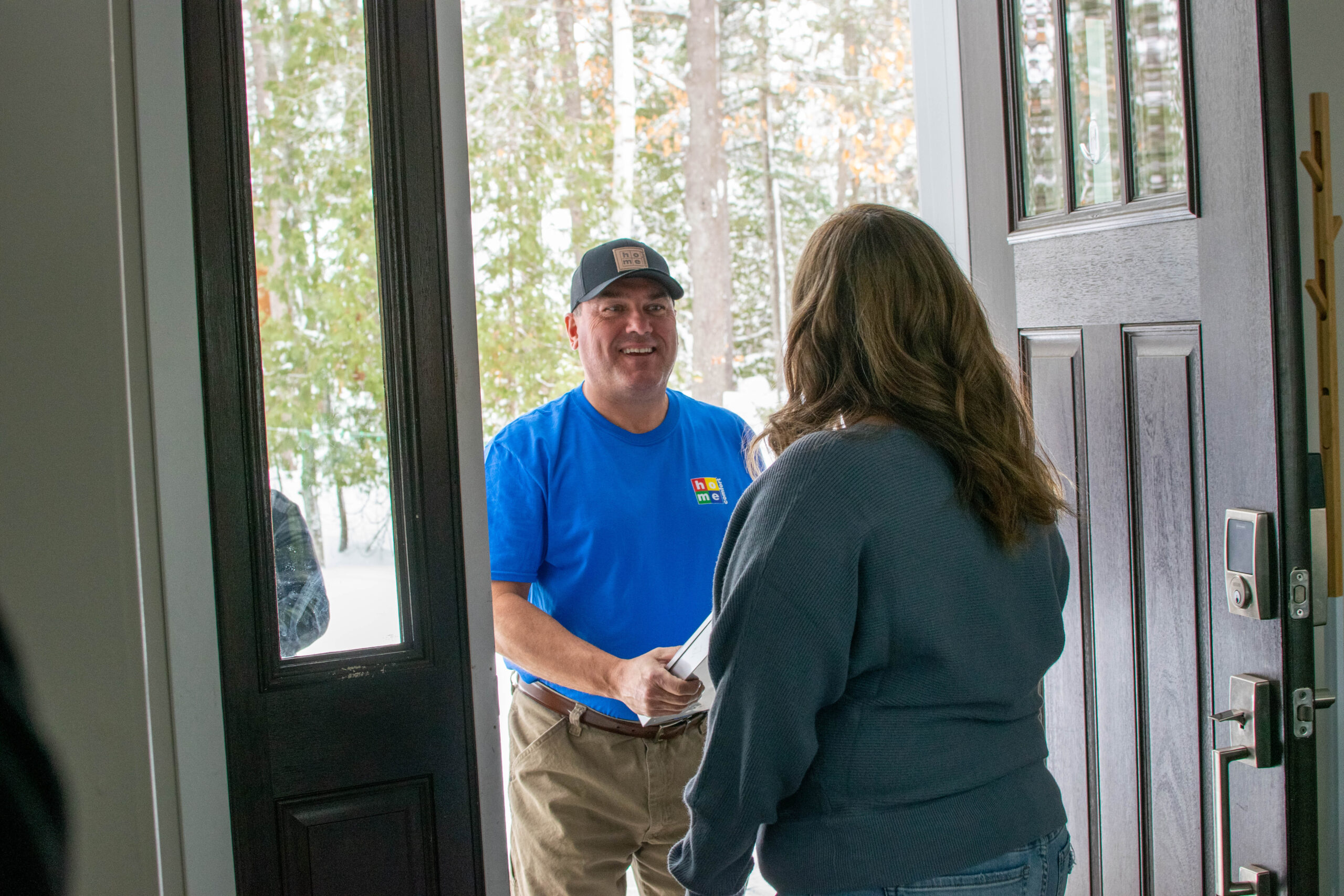 Home Comfort technician at the door of a Chicago homeowner
