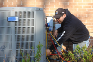 man fixing a central ac unit